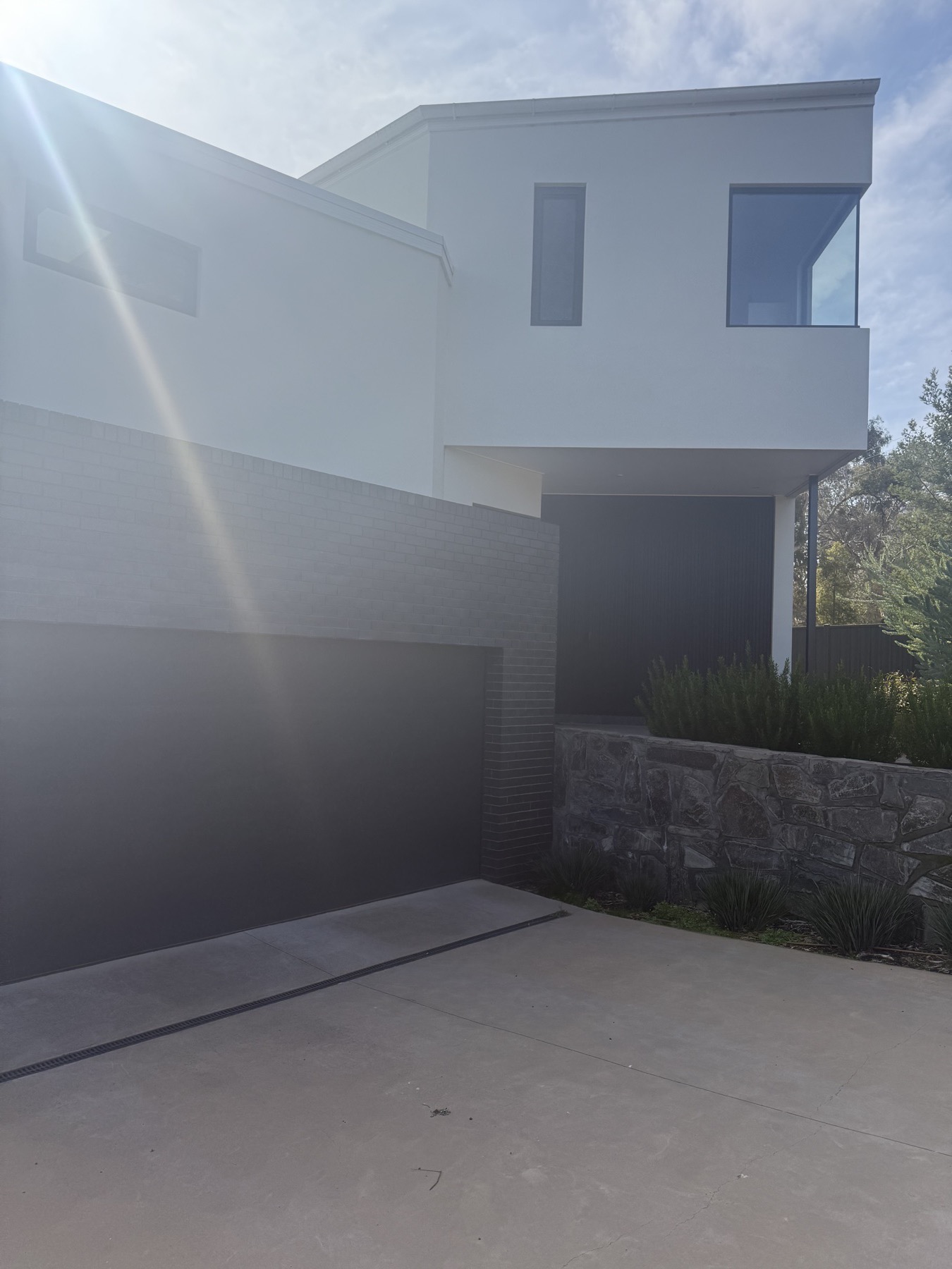 A newly completed two-storey Canberra home with freshly painted rendered walls